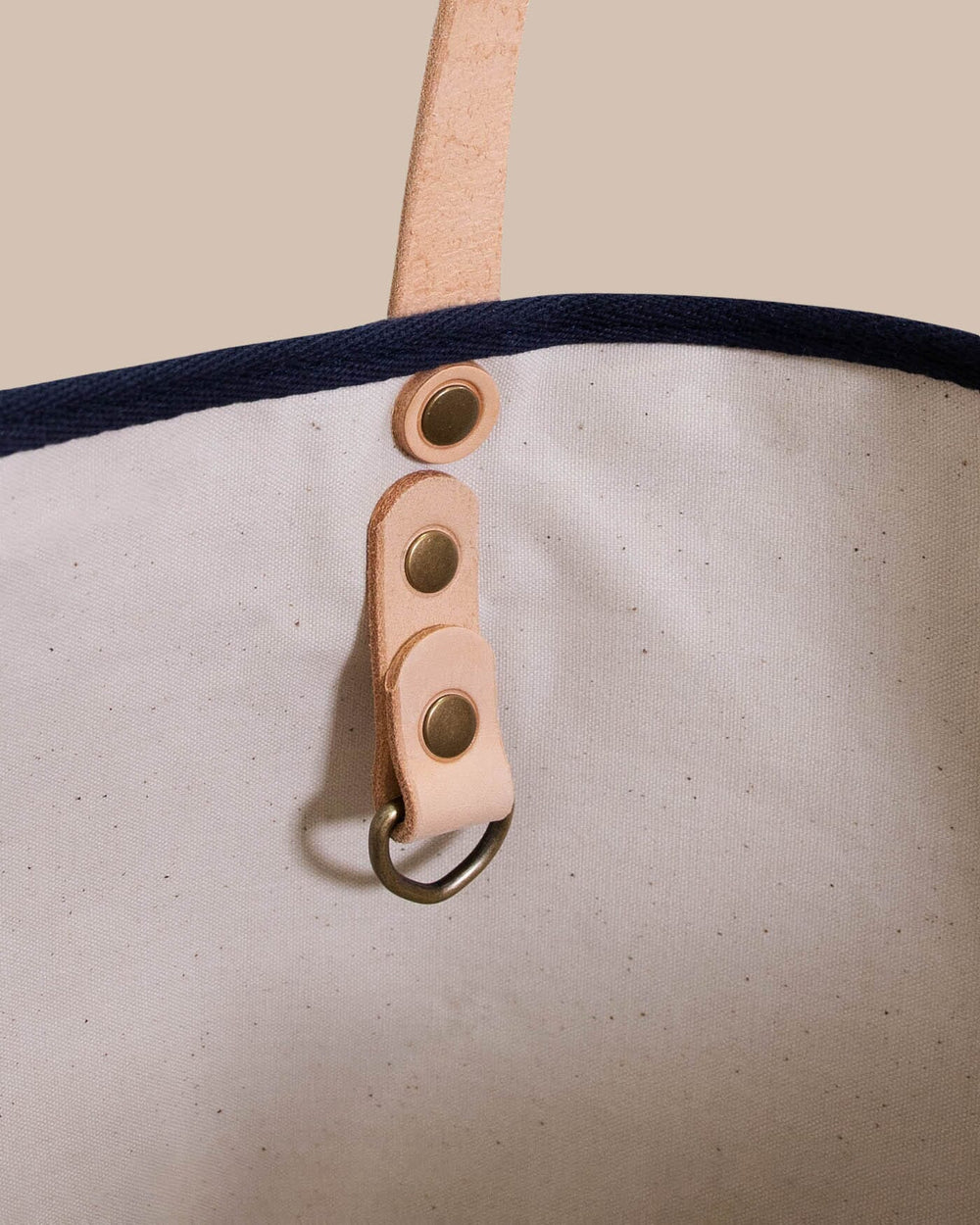 The detail view of the All Day Denim Tote by Southern Tide - Navy
