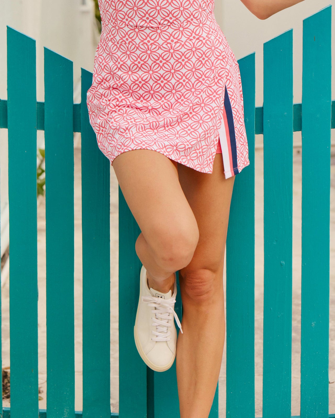The lifestyle view of the Southern Tide Amber Printed Active Skort by Southern Tide - Island Pink