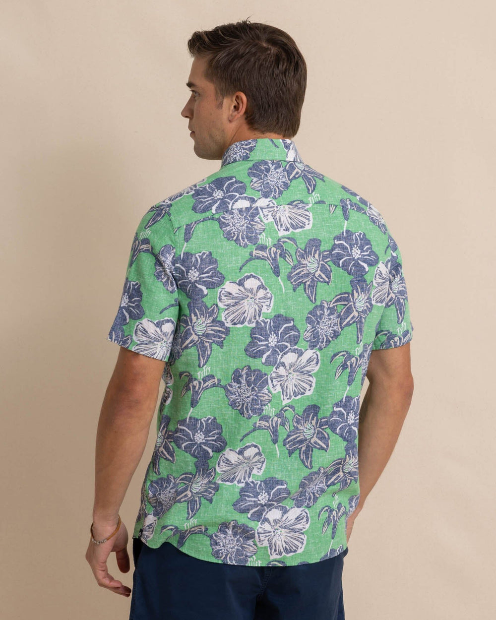 The back view of the Southern Tide Beach Blooms Linen Rayon Short Sleeve Sport Shirt by Southern Tide - Lawn Green