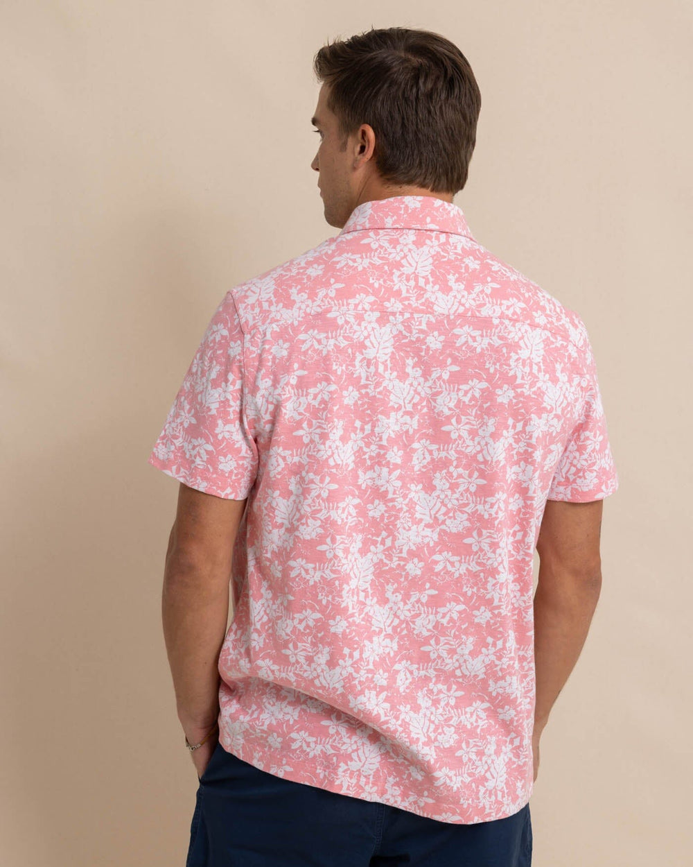 The back view of the Southern Tide Beachcast Island Blooms Knit Short Sleeve Sport Shirt by Southern Tide - Geranium Pink