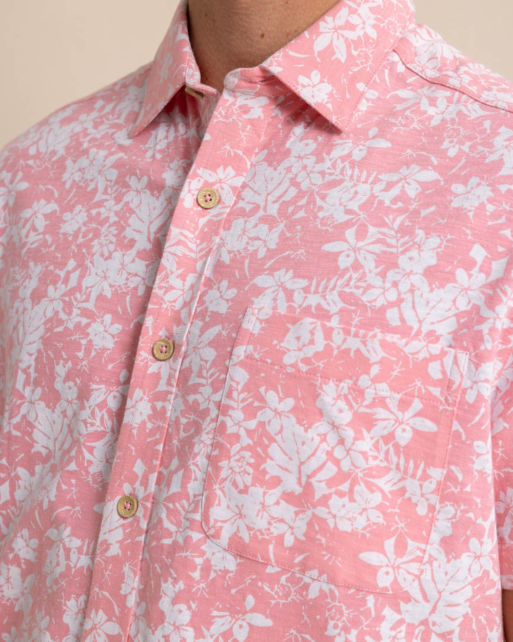 The detail view of the Southern Tide Beachcast Island Blooms Knit Short Sleeve Sport Shirt by Southern Tide - Geranium Pink