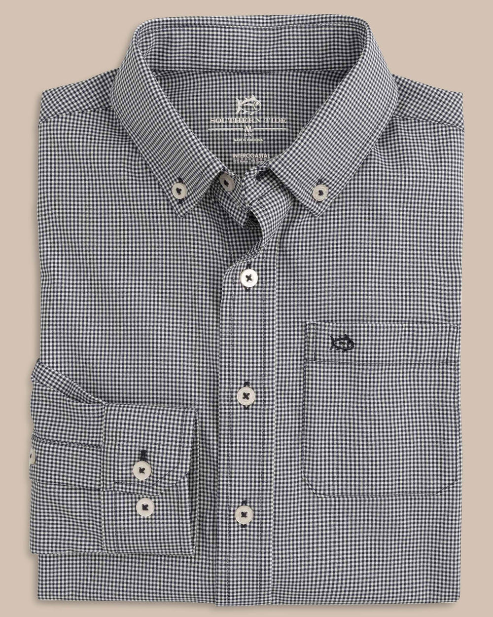 The folded view of the Boys Mini Gingham Intercoastal Button Down Shirt by Southern Tide - True Navy