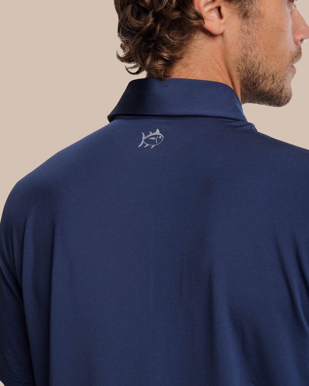 The detail view of the Southern Tide Brenton Chest Stripe Performance Polo by Southern Tide - Navy