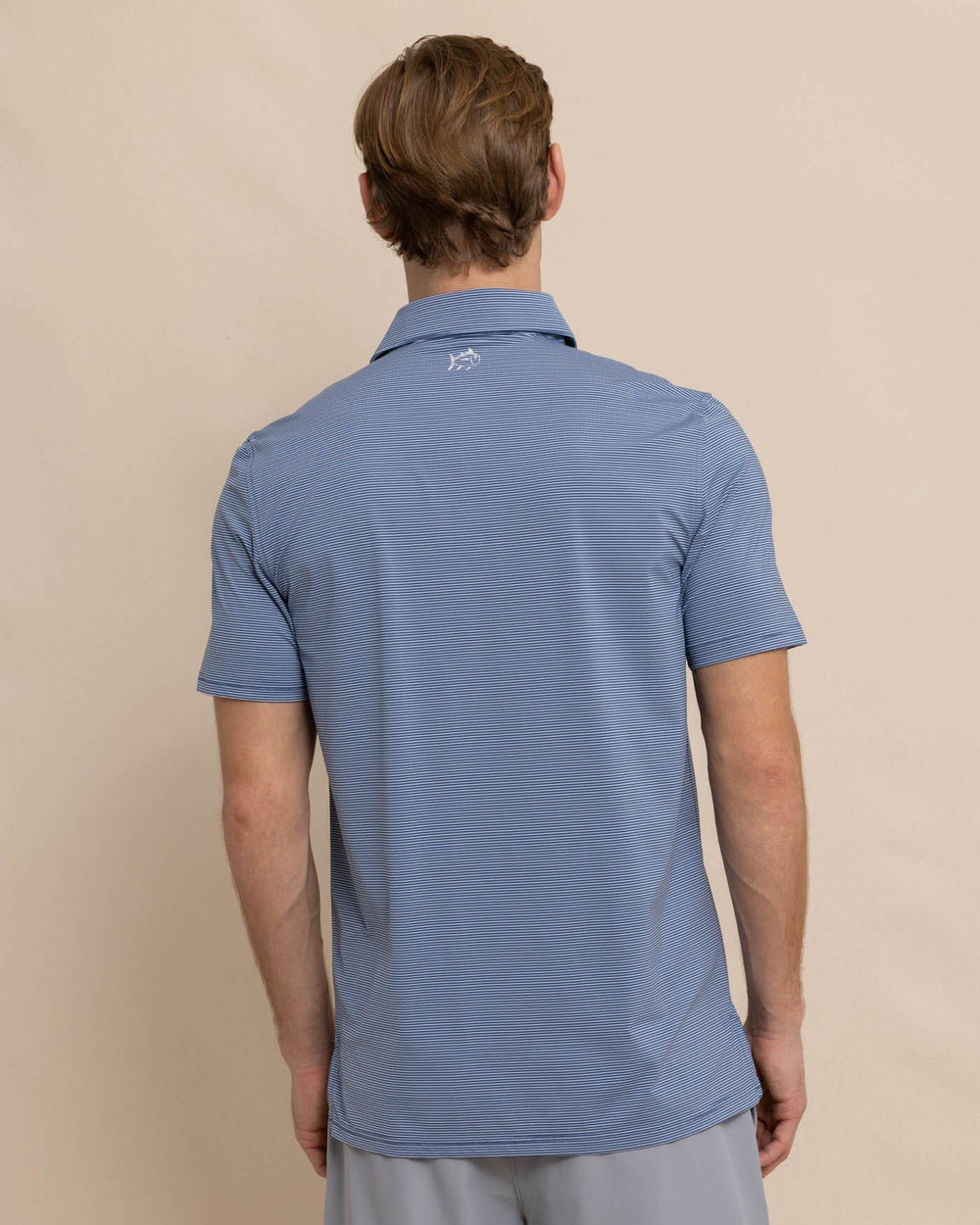 The back view of the Southern Tide brrr-eeze Baytop Stripe Performance Polo by Southern Tide - Aged Denim