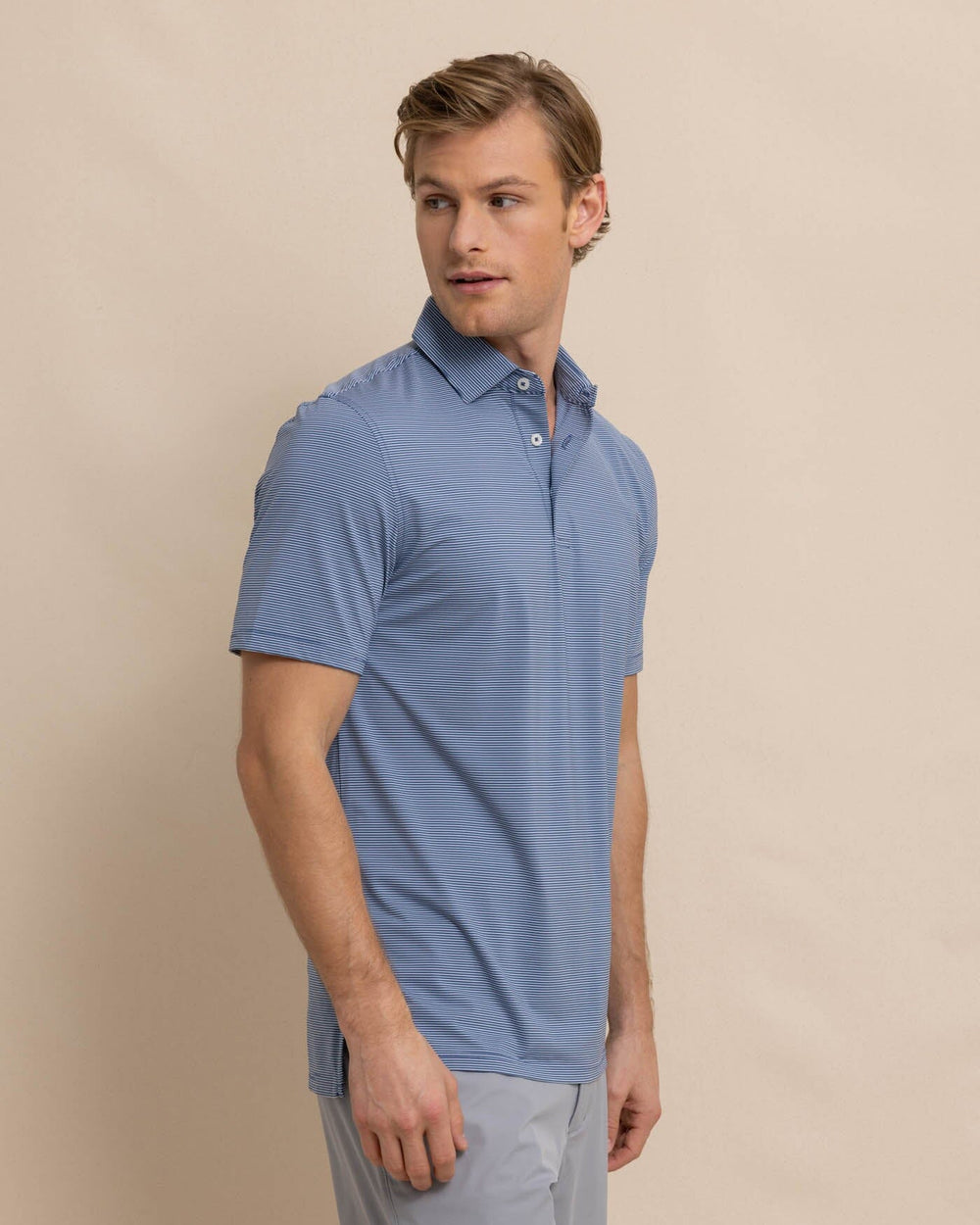 The front view of the Southern Tide brrr-eeze Baytop Stripe Performance Polo by Southern Tide - Aged Denim