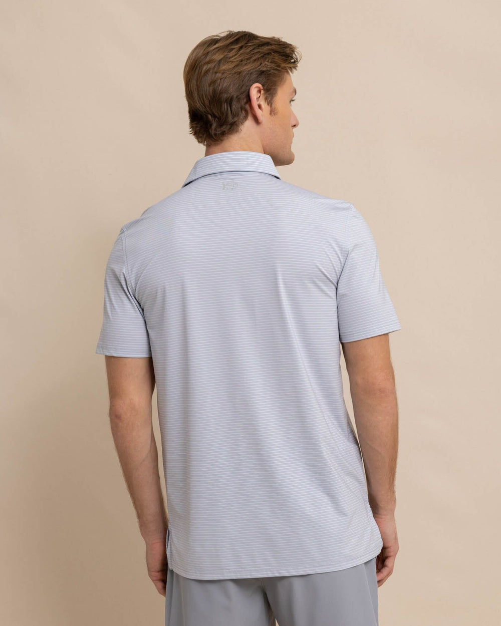 The back view of the Southern Tide brrr-eeze Baytop Stripe Performance Polo by Southern Tide - Platinum Grey