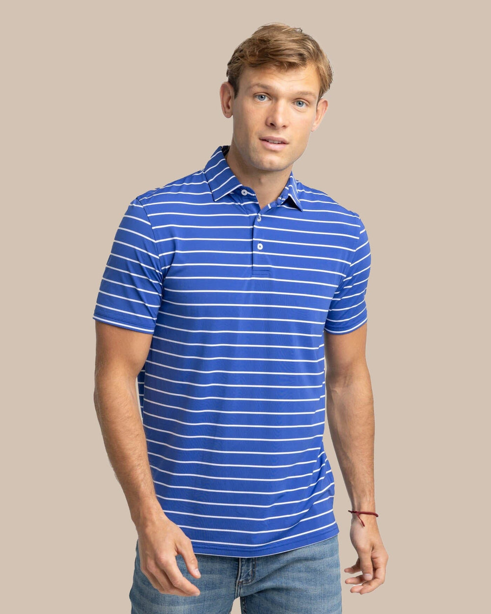 The front view of the Southern Tide brrr-eeze Desmond Stripe Performance Polo by Southern Tide - University Blue