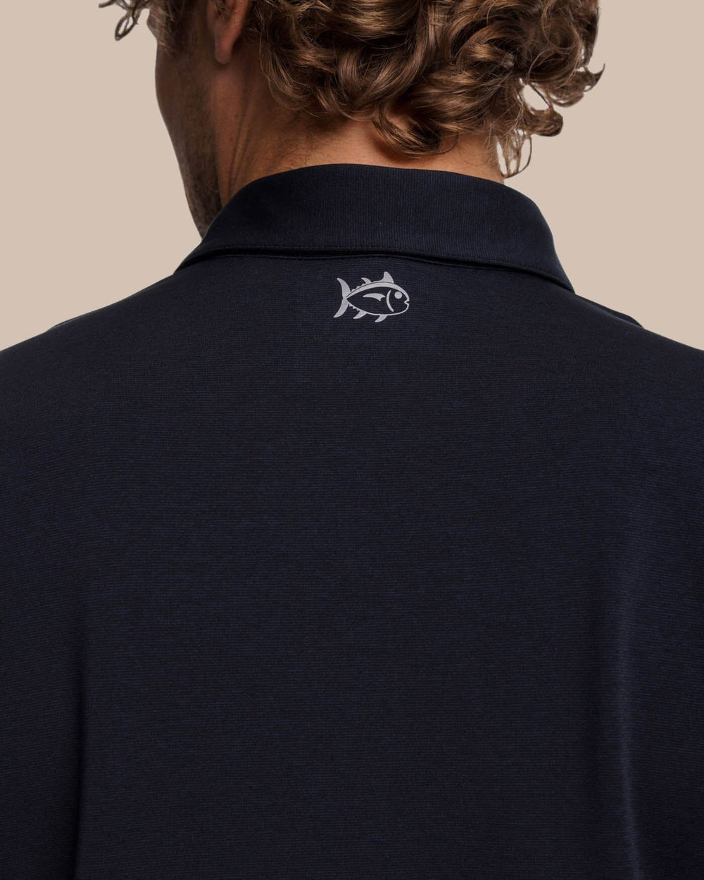The yoke view of the Southern Tide brrr-eeze Heather Performance Polo Shirt by Southern Tide - Heather Caviar Black