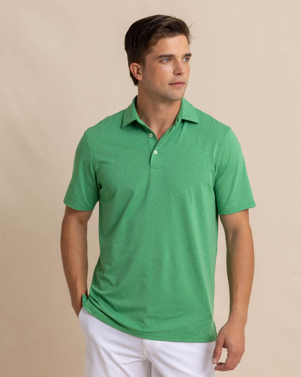 The front view of the Southern Tide brrr-eeze-heather-performance-polo-shirt by Southern Tide - Heather Kelly Green