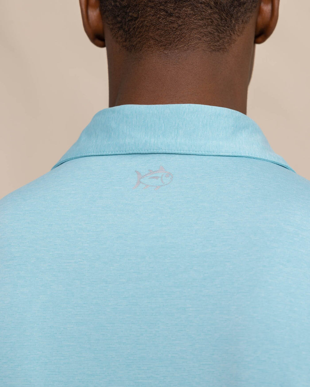 The detail view of the Southern Tide brrr eeze Heather Performance Polo Shirt by Southern Tide - Heather Marine Blue