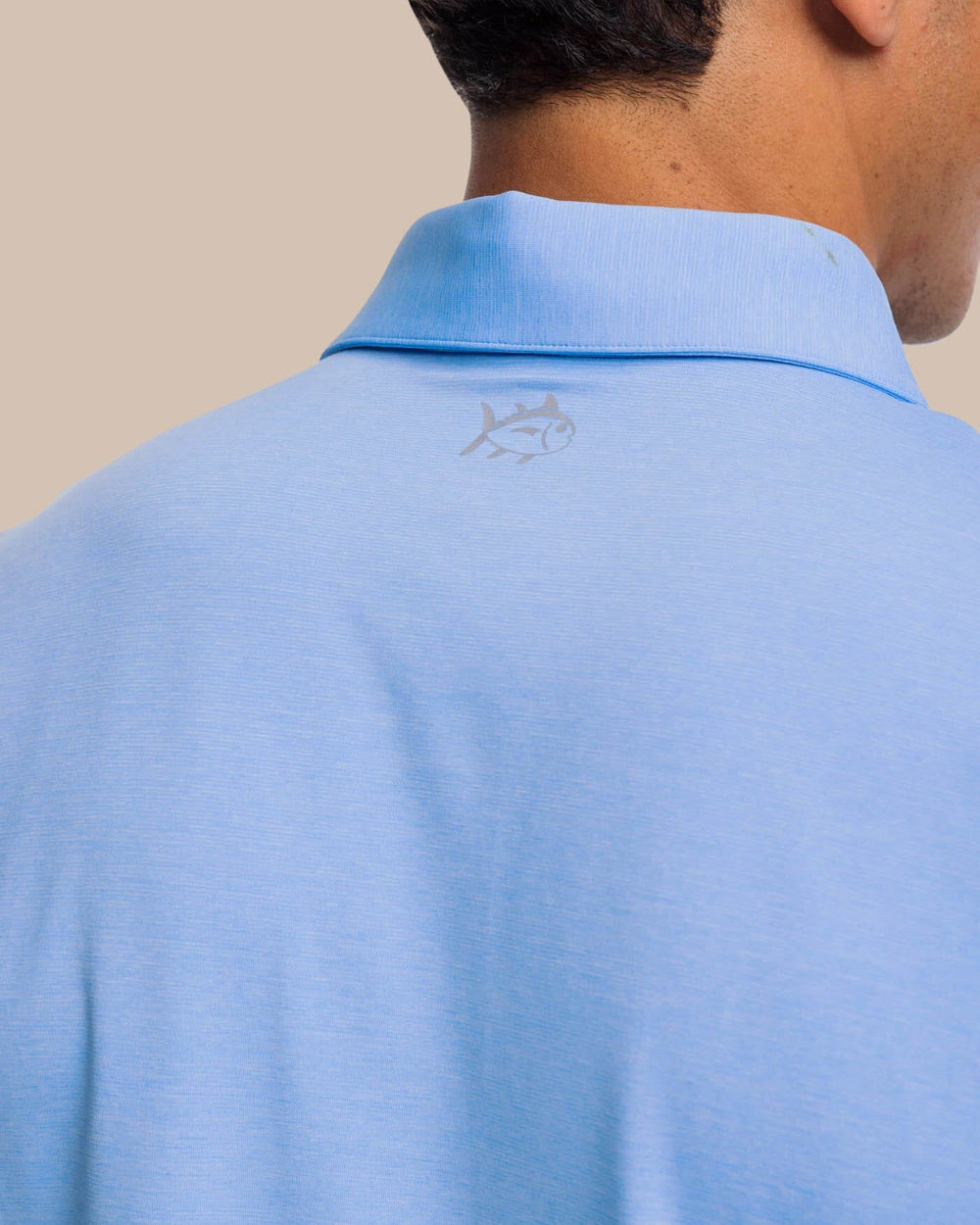 The yoke view of the brrr°®-eeze Heather Performance Polo Shirt by Southern Tide - Heather Ocean Channel