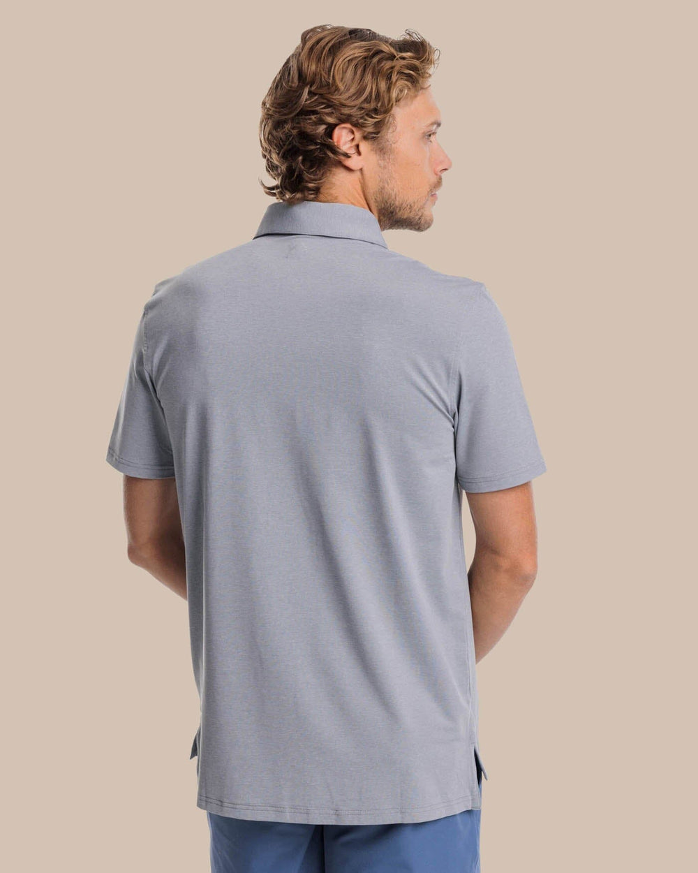 The back view of the brrr°®-eeze Heather Performance Polo Shirt by Southern Tide - Heather Steel Grey