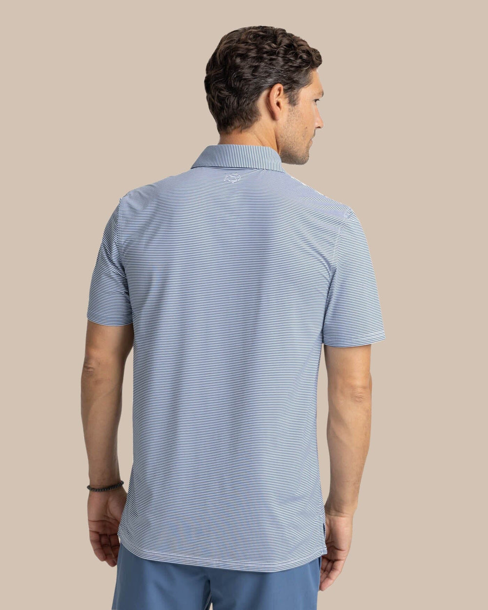 The back view of the Southern Tide brrr-eeze Meadowbrook Stripe Polo by Southern Tide - Aged Denim