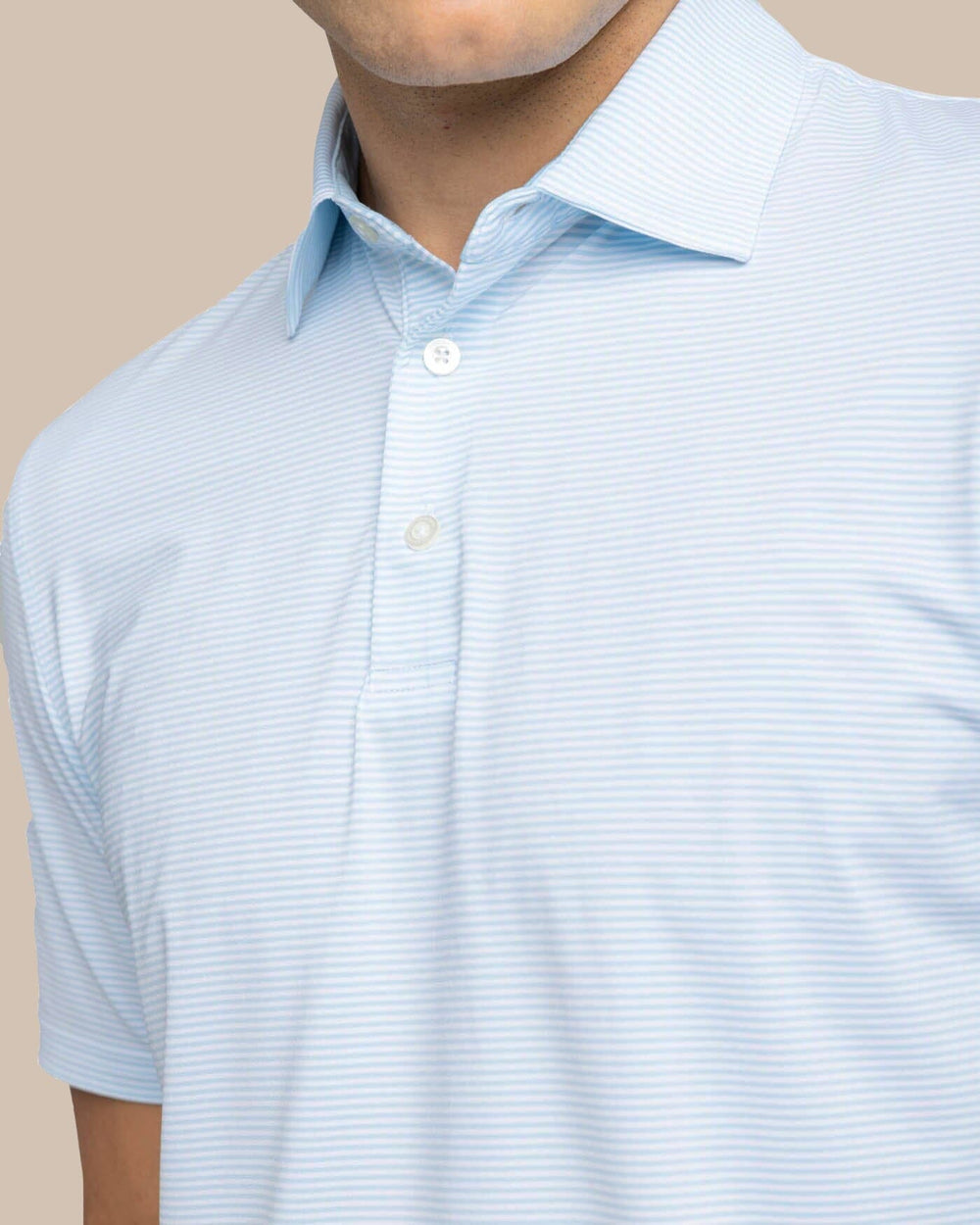 The detail view of the Southern Tide brrr-eeze Meadowbrook Stripe Polo by Southern Tide - Clearwater Blue