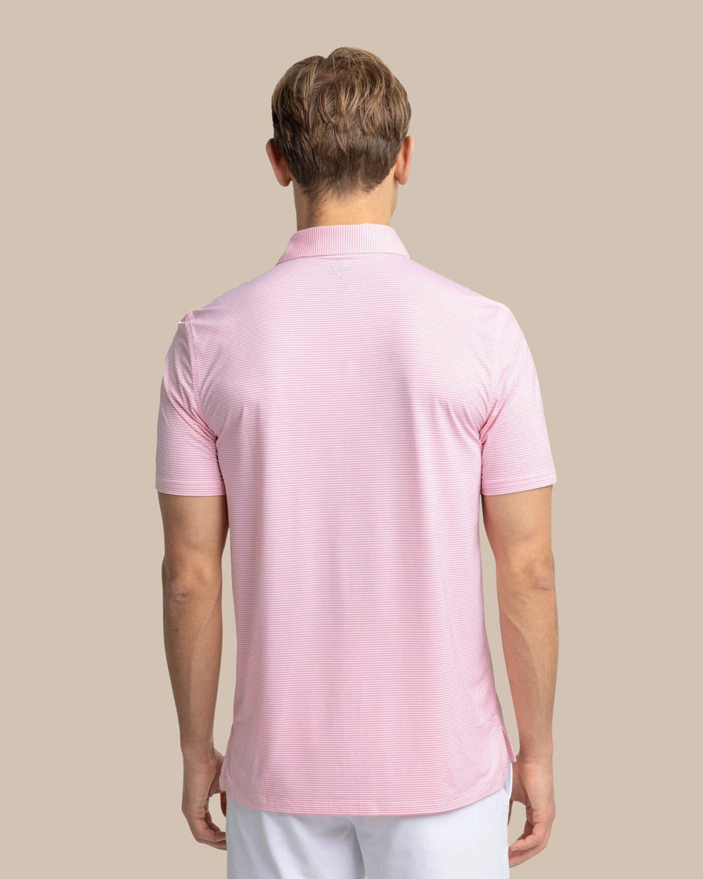 The back view of the Southern Tide brrr-eeze Meadowbrook Stripe Polo by Southern Tide - Geranium Pink