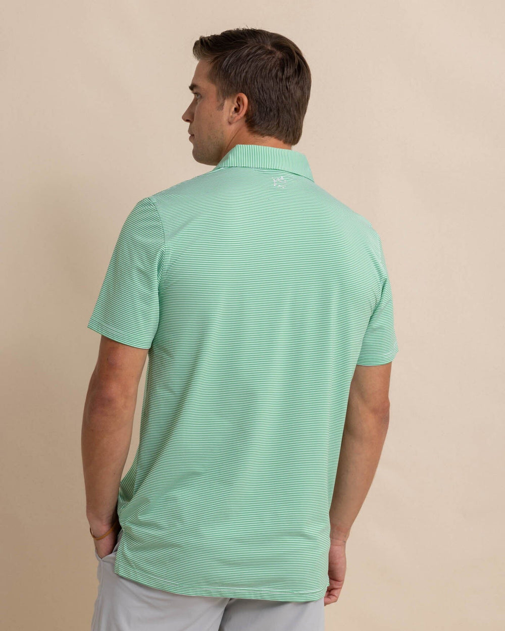 The back view of the Southern Tide brrr-eeze-meadowbrook-stripe-polo by Southern Tide - Lawn Green