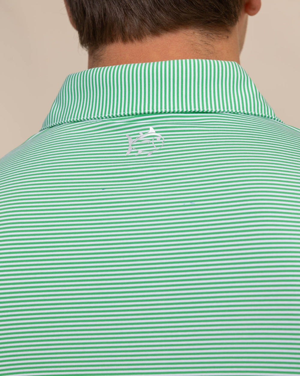 The detail view of the Southern Tide brrr-eeze-meadowbrook-stripe-polo by Southern Tide - Lawn Green