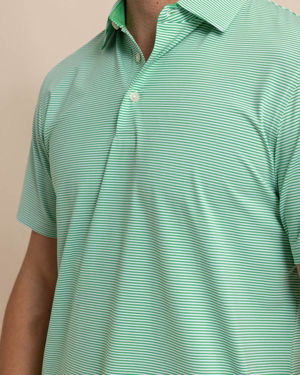 The detail view of the Southern Tide brrr-eeze-meadowbrook-stripe-polo by Southern Tide - Lawn Green
