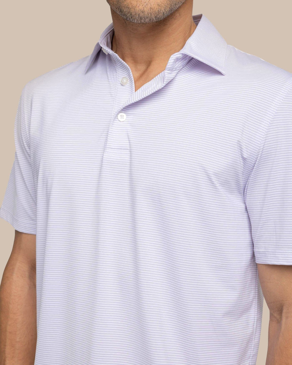 The detail view of the Southern Tide brrr-eeze Meadowbrook Stripe Polo by Southern Tide - Orchid Petal