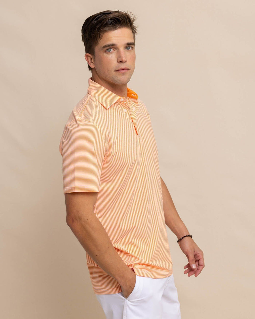 The front view of the Southern Tide brrr-eeze-meadowbrook-stripe-polo by Southern Tide - Tangerine Orange