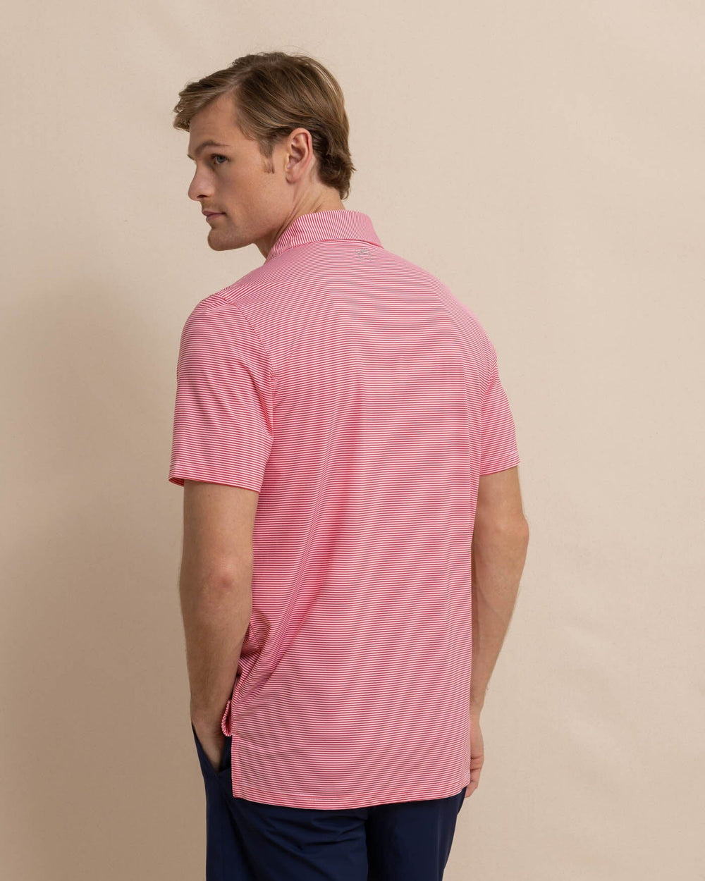 The back view of the Southern Tide brrr-eeze-meadowbrook-stripe-polo by Southern Tide - Teaberry Pink