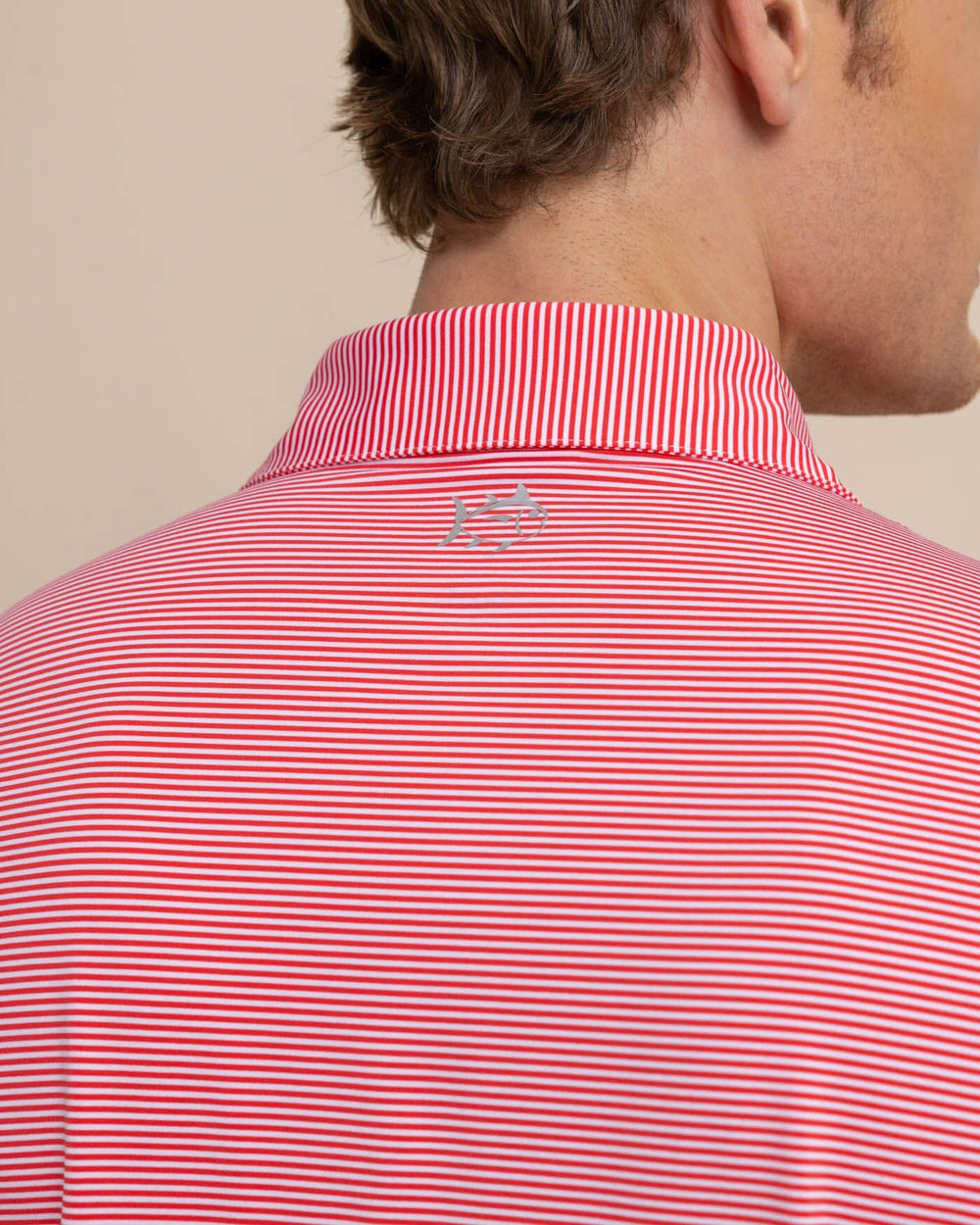 The detail view of the Southern Tide brrr-eeze-meadowbrook-stripe-polo by Southern Tide - Teaberry Pink