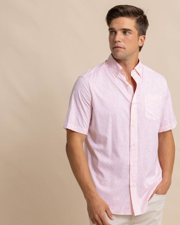 The front view of the Southern Tide brrr Intercoastal That Floral Feeling Short Sleeve Sport Shirt by Southern Tide - Apricot Blush Coral