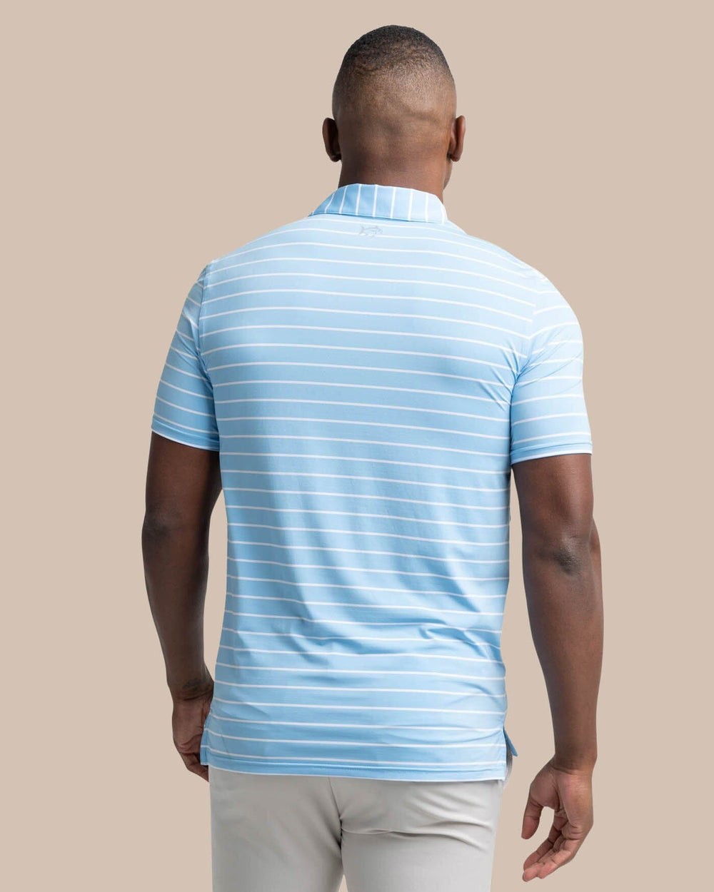 The back view of the Southern Tide brrr-eeze Desmond Stripe Performance Polo by Southern Tide - Rush Blue