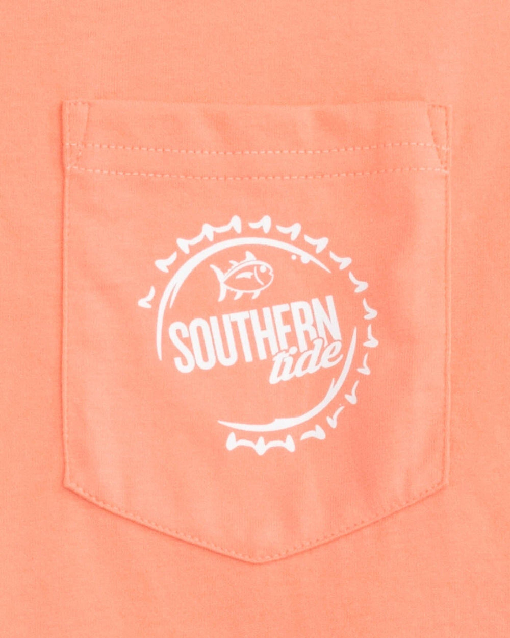 The detail view of the Southern Tide Caps Off Badge Short Sleeve T-shirt by Southern Tide - Desert Flower Coral