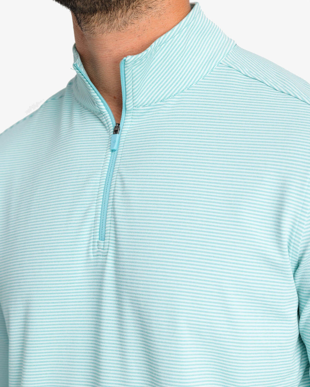 The detail view of the Southern Tide Cruiser Heather Micro-Stripe Performance Quarter Zip by Southern Tide - Heather Tidal Wave