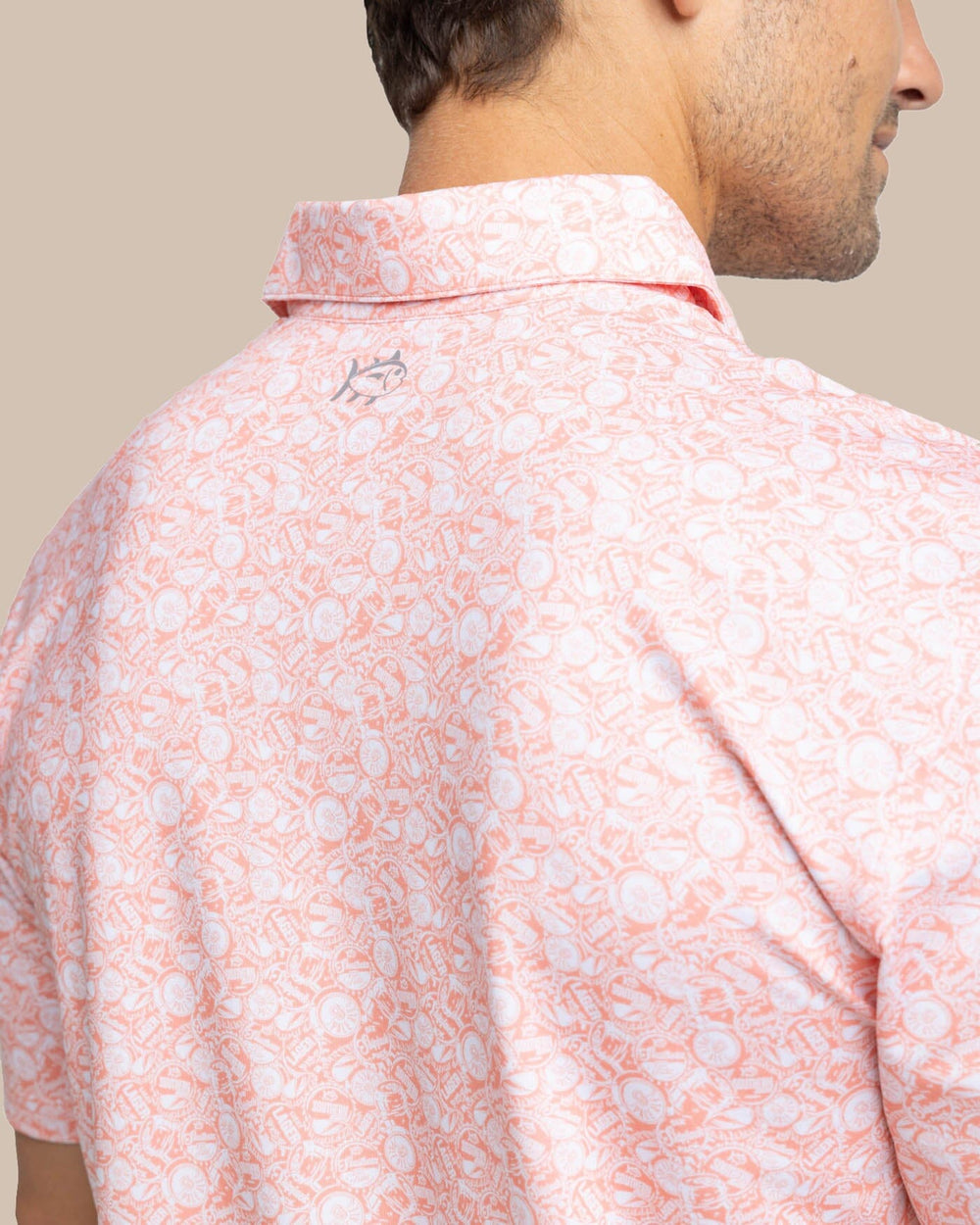 The detail view of the Southern Tide Driver Caps Off Printed Polo by Southern Tide - Desert Flower Coral