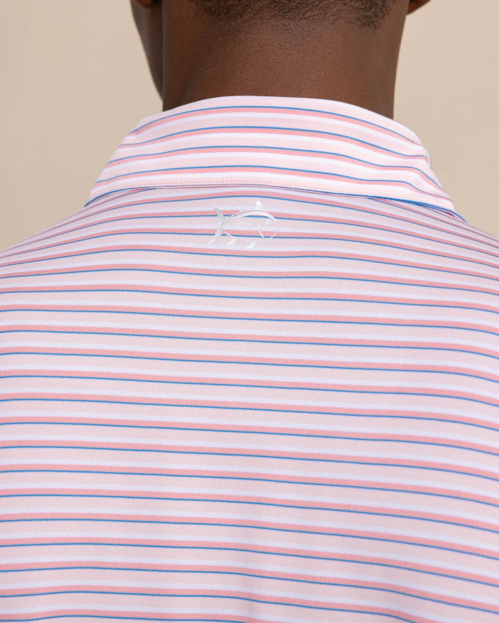 The detail view of the Southern Tide Driver Carova Stripe Polo Shirt by Southern Tide - Light Pink