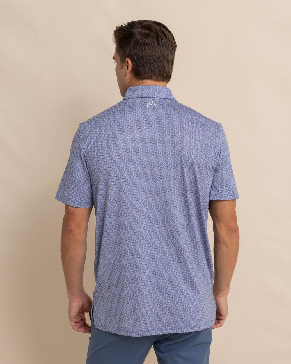 The back view of the Southern Tide Driver Vacation Views Printed Polo by Southern Tide - Wisteria Purple