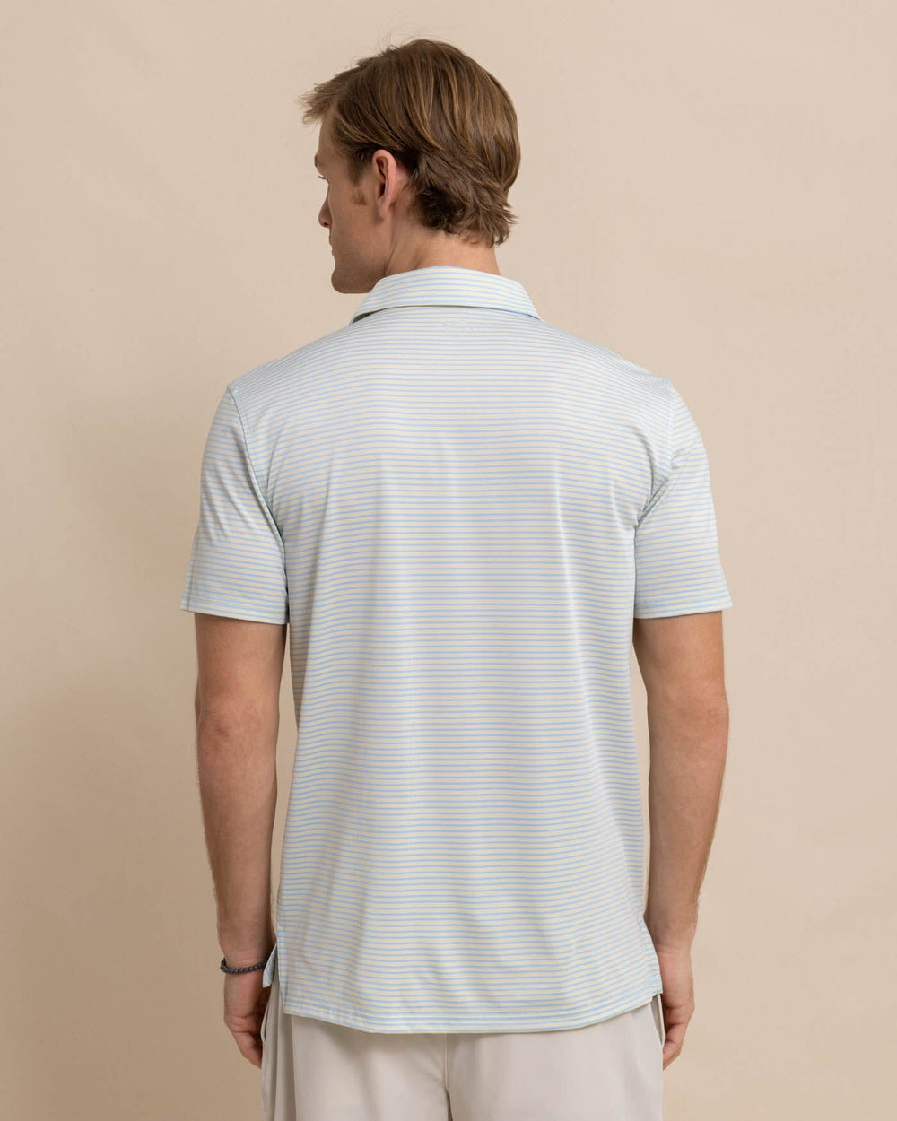 The back view of the Southern Tide Driver Verdae Stripe Polo by Southern Tide - Golden Haze Yellow