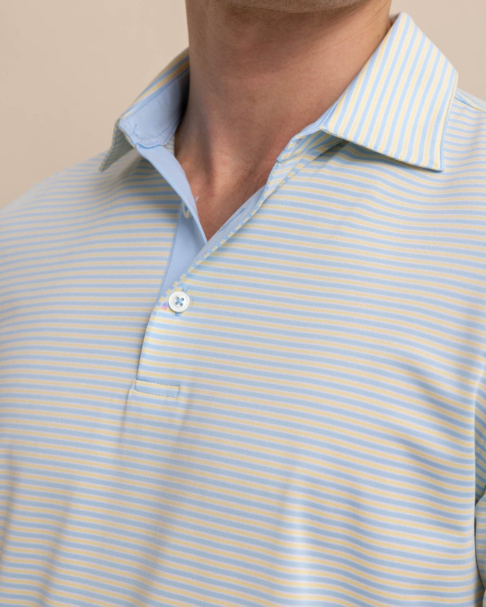 The detail view of the Southern Tide Driver Verdae Stripe Polo by Southern Tide - Golden Haze Yellow