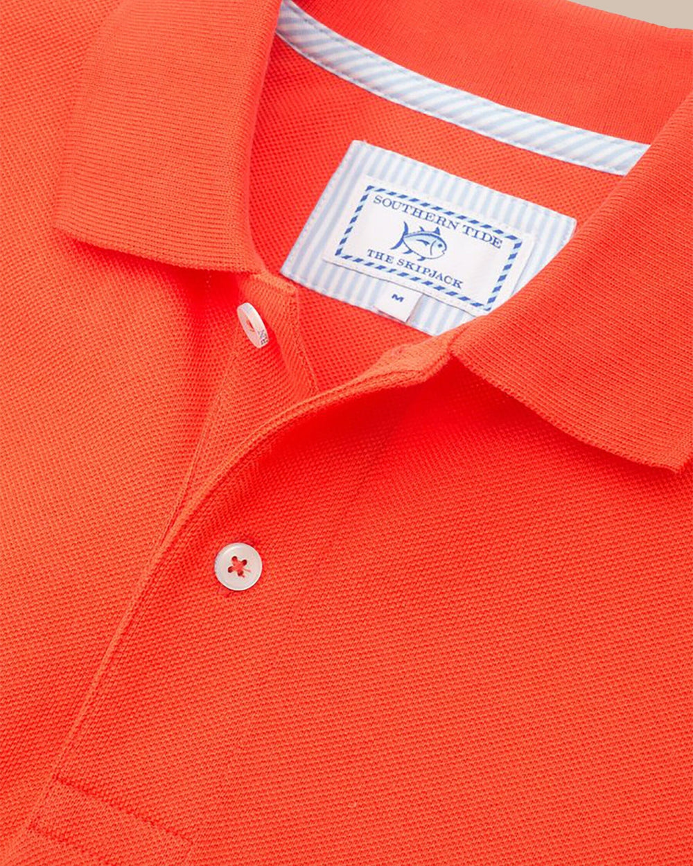 The detail view of the Men's Orange Skipjack Gameday Colors Polo Shirt by Southern Tide - Endzone Orange