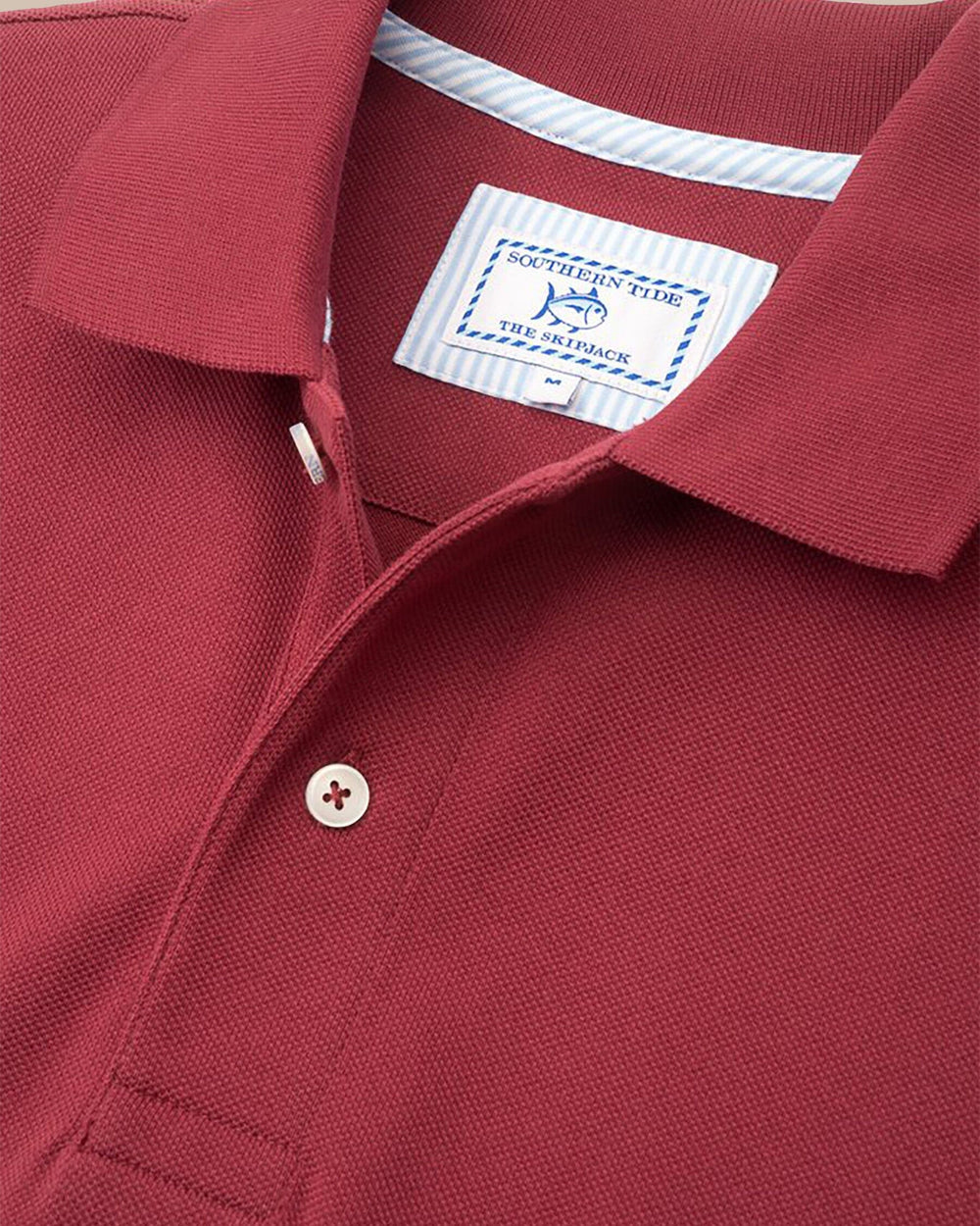 The detail view of the Men's Red Skipjack Gameday Colors Polo Shirt by Southern Tide - Chianti