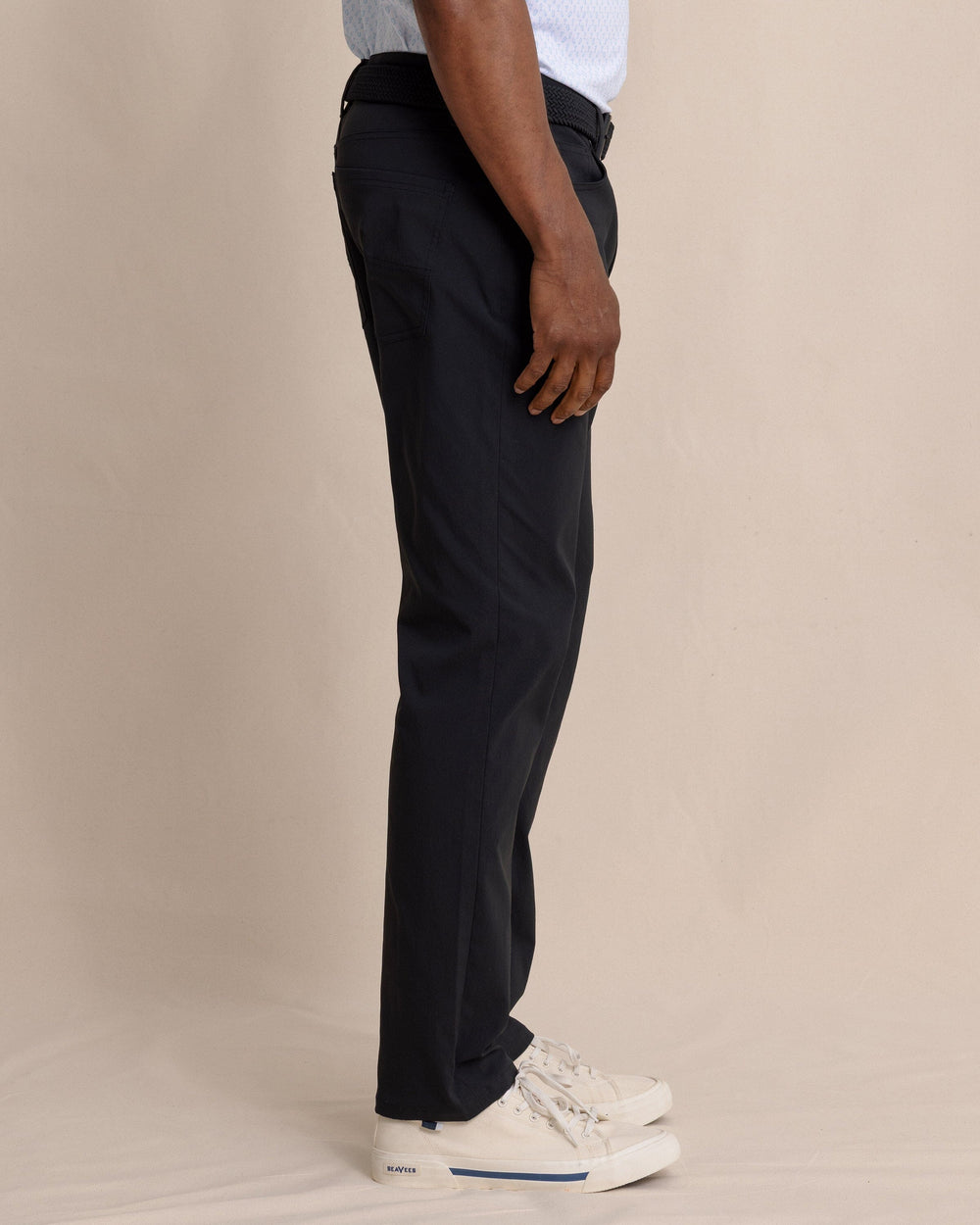 The side view of the Southern Tide Intercoastal Performance Pant in Caviar Black by Southern Tide - Caviar Black