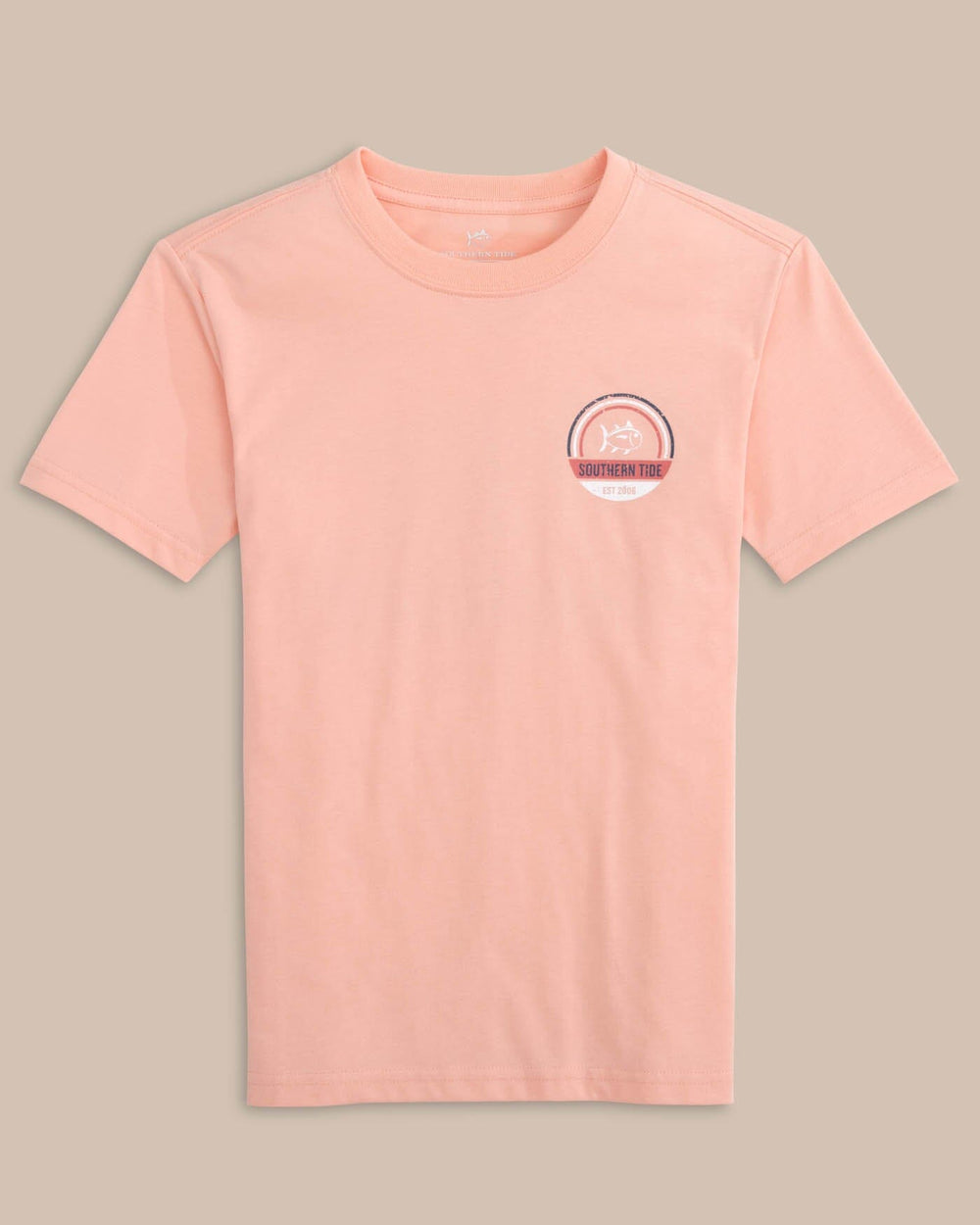 The front view of the Southern Tide Kids Shack Circle Short Sleeve T-shirt by Southern Tide - Apricot Blush Coral