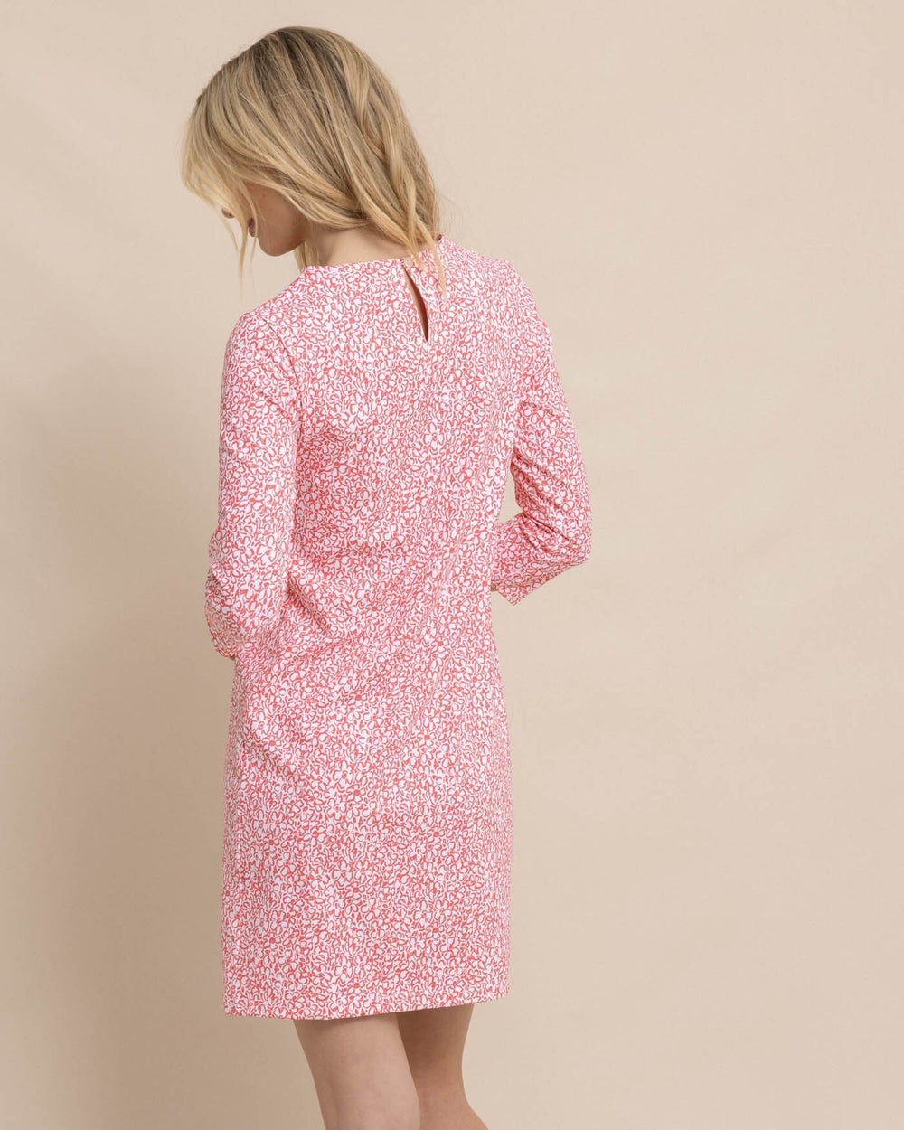 The back view of the Southern Tide Leira That Floral Feeling Print Performance Dress by Southern Tide - Conch Shell 