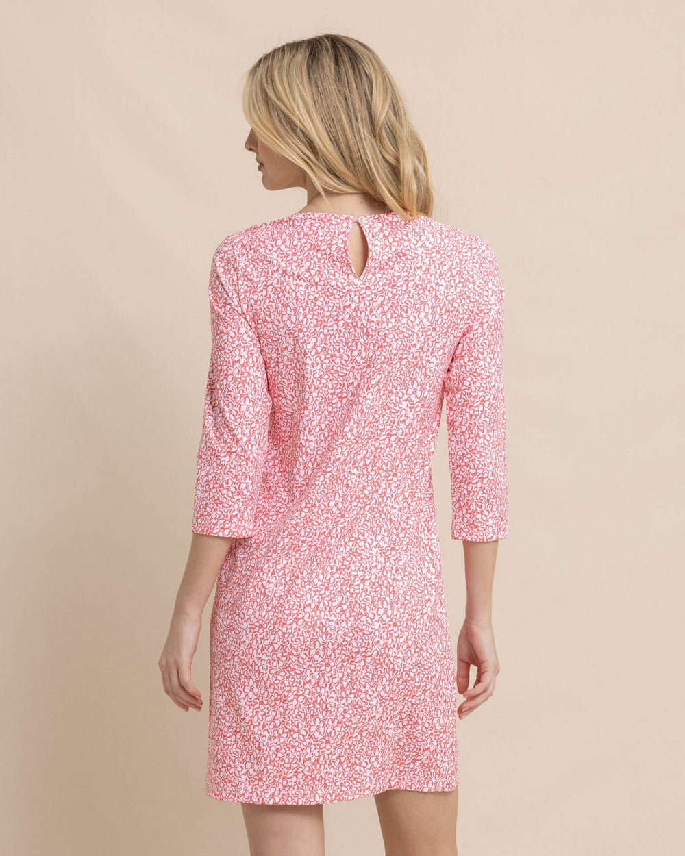 The back view of the Southern Tide Leira That Floral Feeling Print Performance Dress by Southern Tide - Conch Shell