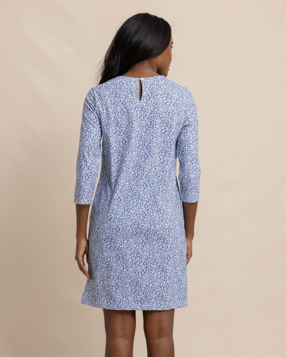 The back view of the Southern Tide Leira That Floral Feeling Print Performance Dress by Southern Tide - Coronet Blue