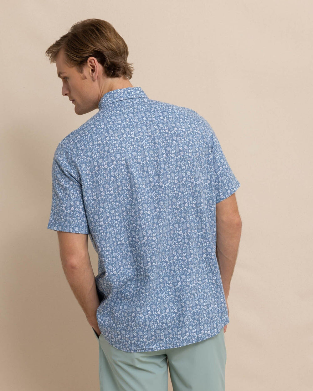 The back view of the Southern Tide Linen Rayon Ditzy Floral Short Sleeve Sport Shirt by Southern Tide - Coronet Blue