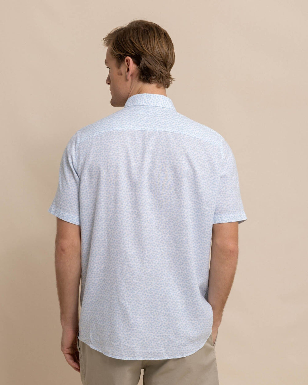 The back view of the Southern Tide Linen Rayon Palm and Breezy Short Sleeve Sport Shirt by Southern Tide - Clearwater Blue