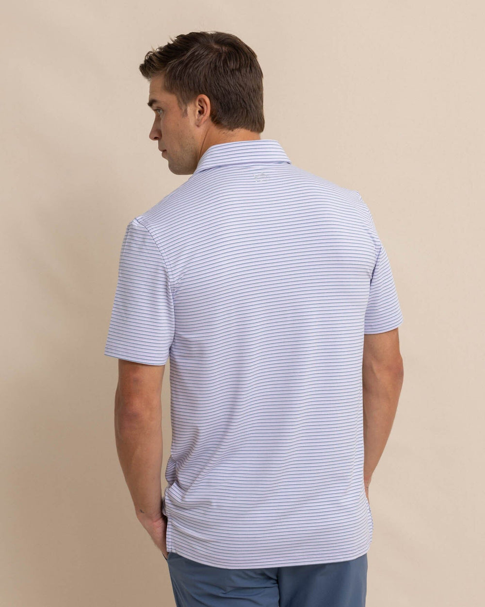 The back view of the Southern Tide Ryder Heather Halls Performance Polo by Southern Tide - Heather Orchid Petal