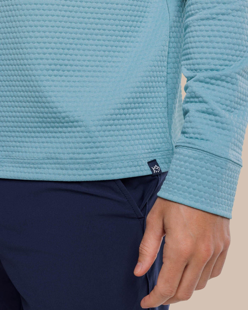The detail view of the Southern Tide Scuttle Heather Performance Quarter Zip Hoodie by Southern Tide - Heather Ocean Teal