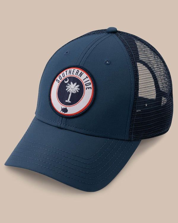 The front view of the Men's South Carolina Patch Performance Trucker Hat by Southern Tide - Seven Seas Blue