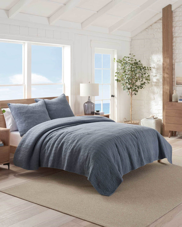 The front view of the Southern Tide Southern Tide Laurel Grove Quilt by Southern Tide - Navy