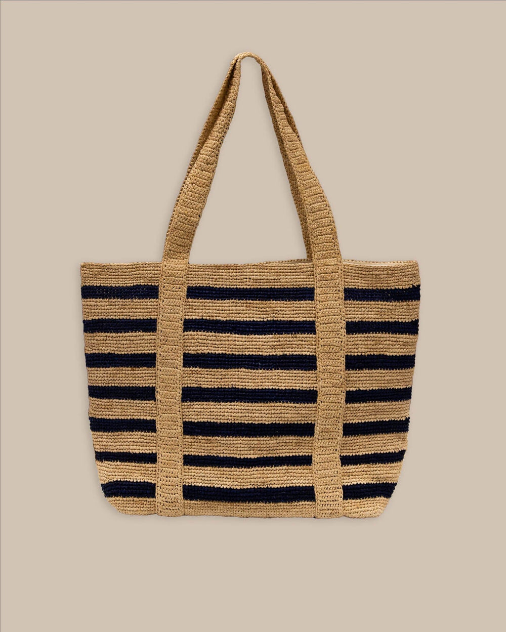 The back view of the Southern Tide Striped Straw Hat Carrier Beach Tote by Southern Tide - Navy