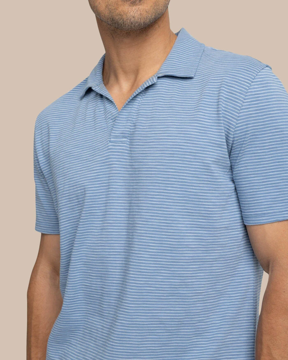 The detail view of the Southern Tide Sun Farer Summertree Stripe Polo by Southern Tide - Coronet Blue